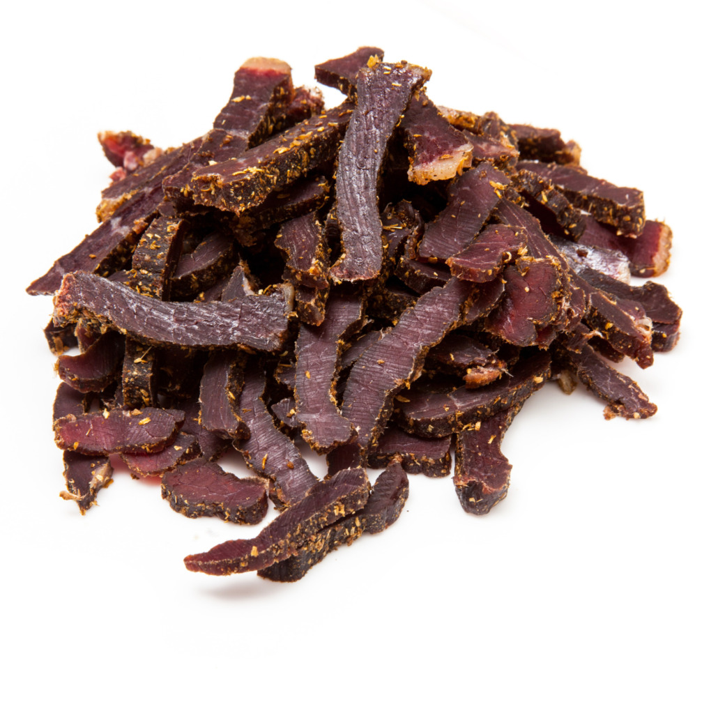 what is biltong. A picture showing strips of beef biltong made by Raging Bull Snacks.
